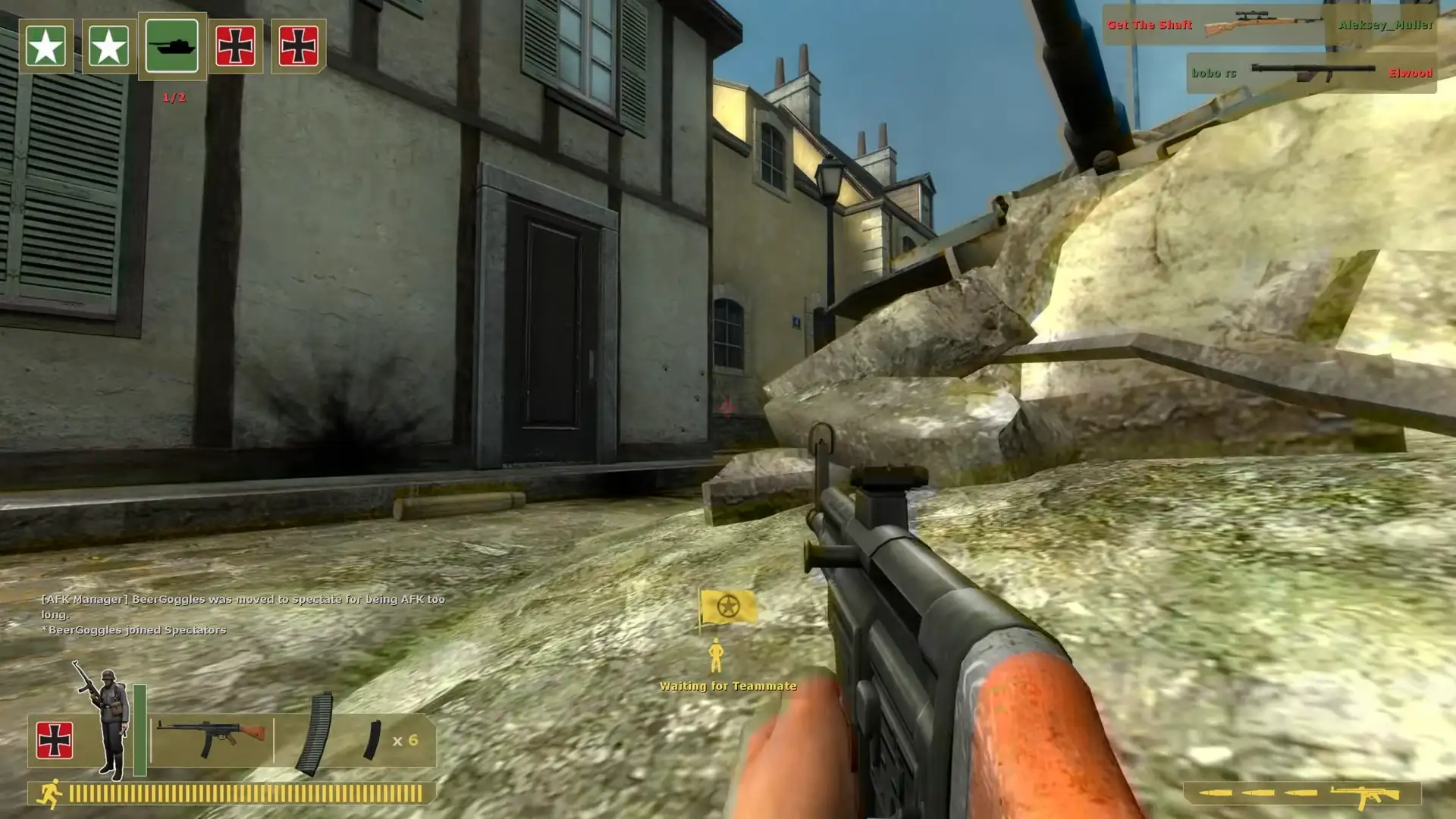 Hiding behind rubble in the middle of the map