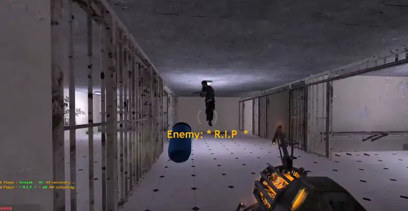 a player jumps over a flung barrel in a prison cell complex