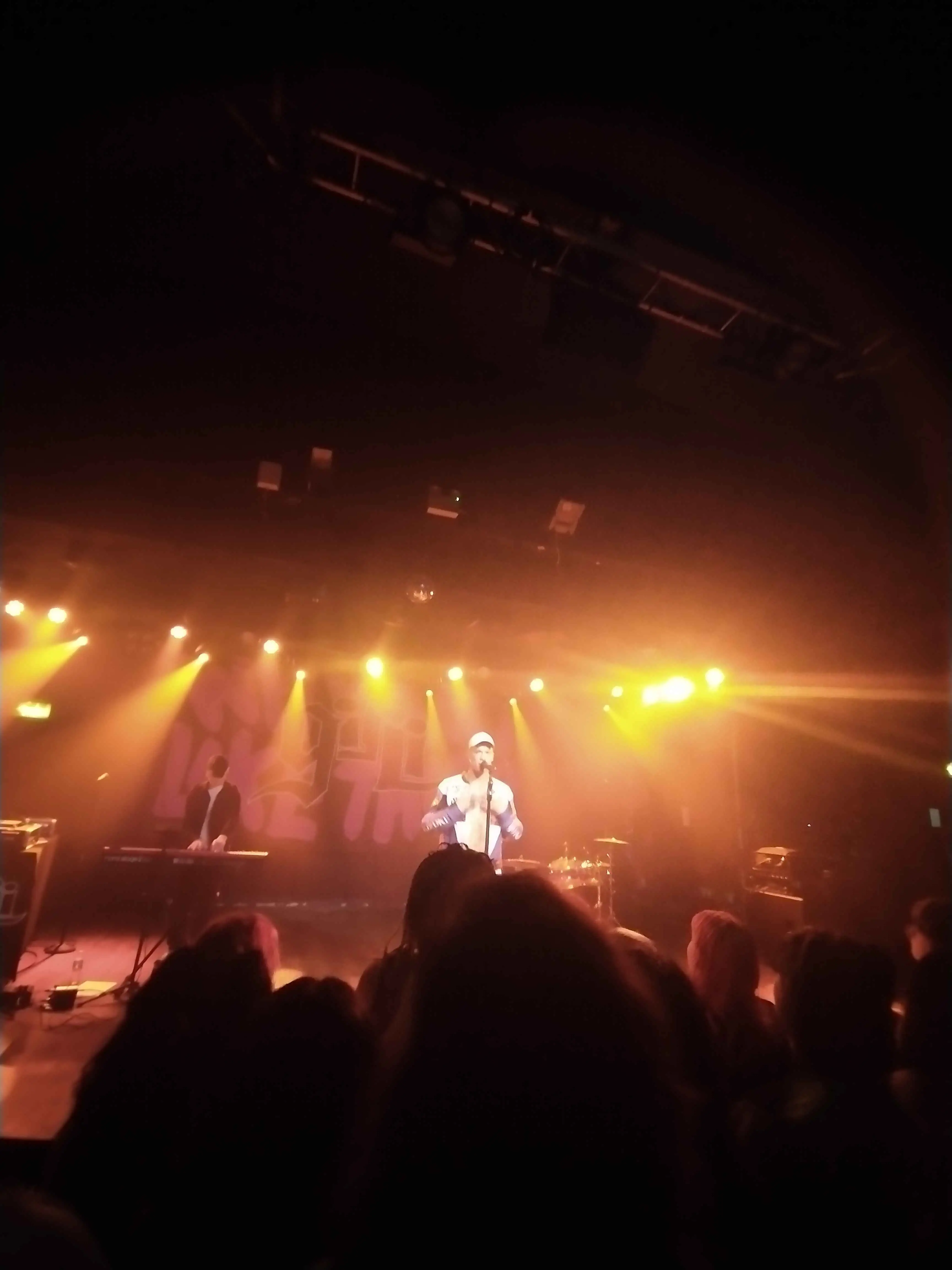 Distant shots of Singers on stage.