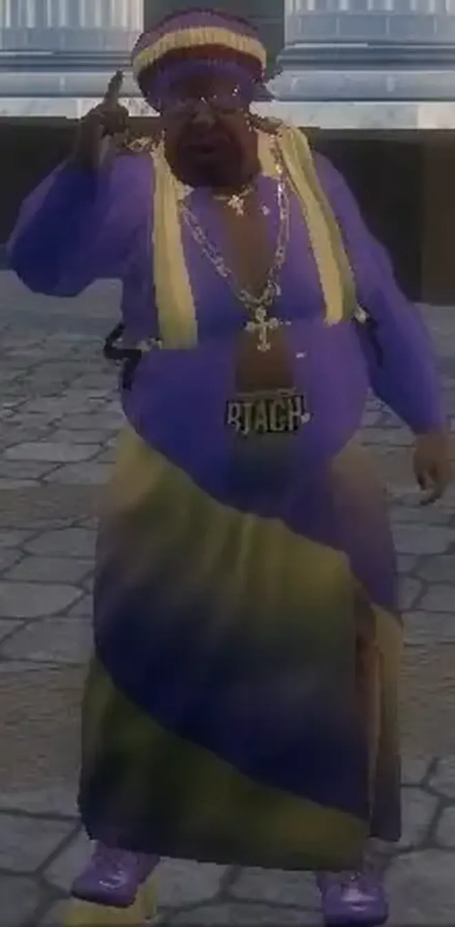 My Saints Row 2 protagonist, a fat black man with pink facial hair and a purple and yellow robe, he has a cross pendant around his neck and a &ldquo;BIATCH&rdquo; plate on his crotch