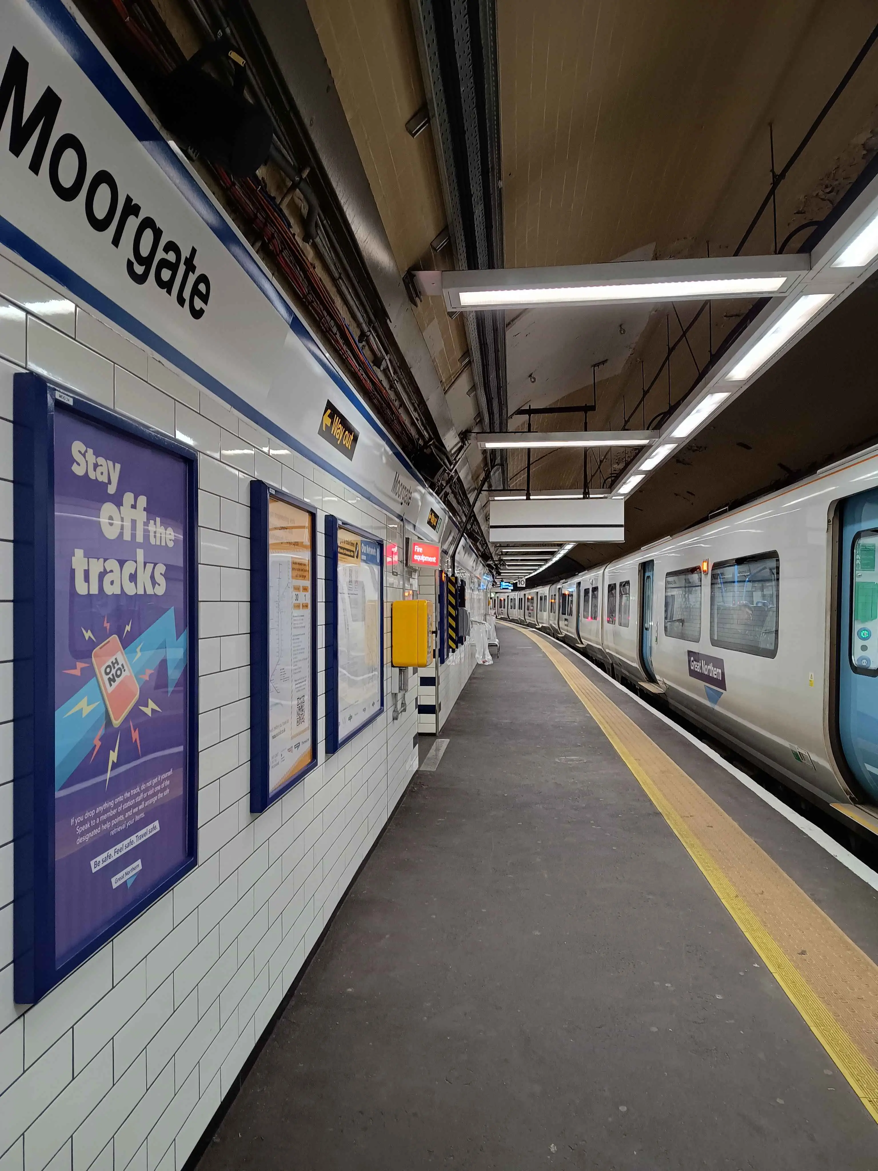 Inside Moorgate Station, with a Great Northern train on the platform.