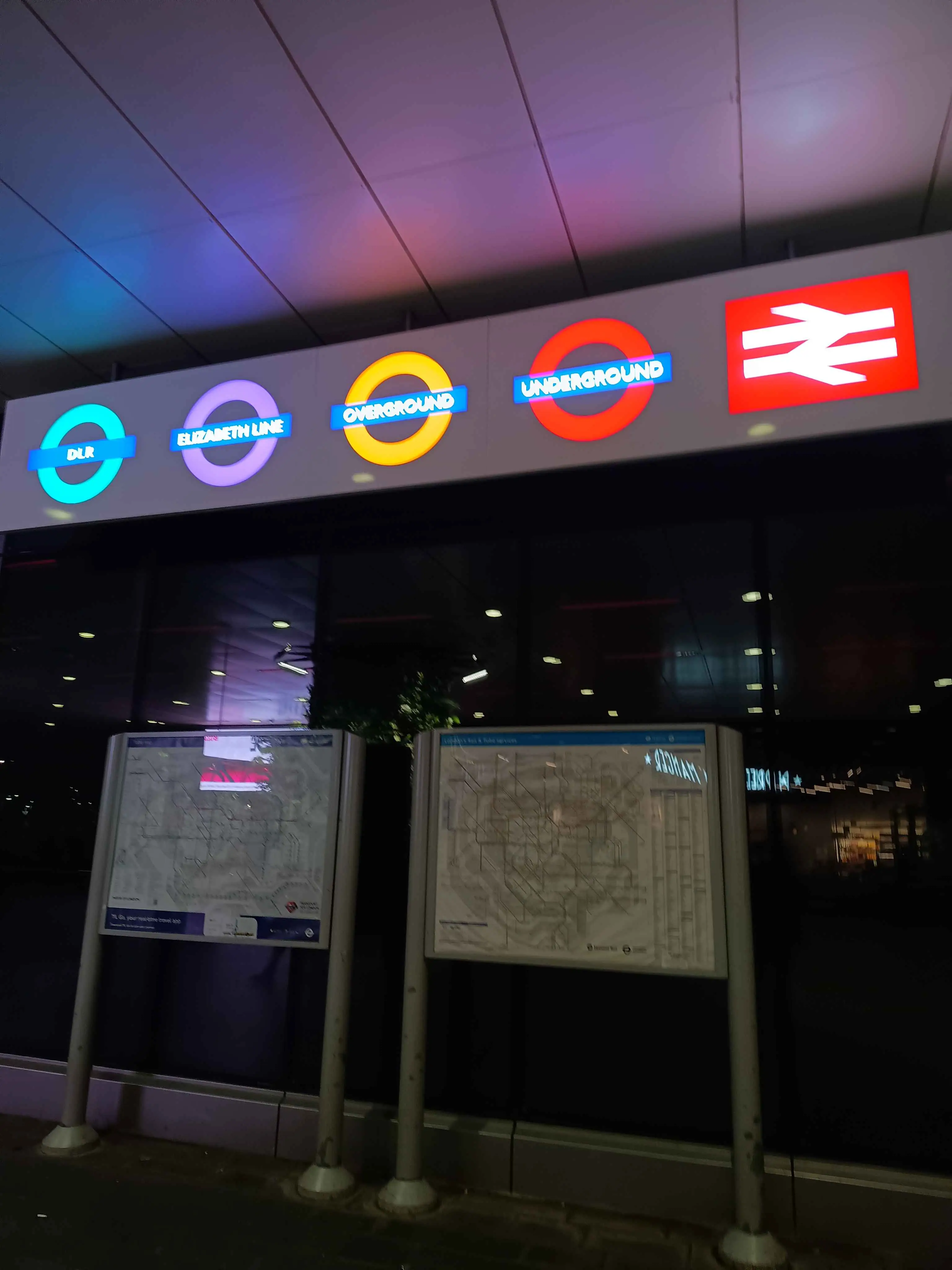 Stratford station, the Tube and Tube and Rail map side by side, with the logos of different transport links (DLR, Elizabeth Line, Overground, Underground and National Rail) shining above.