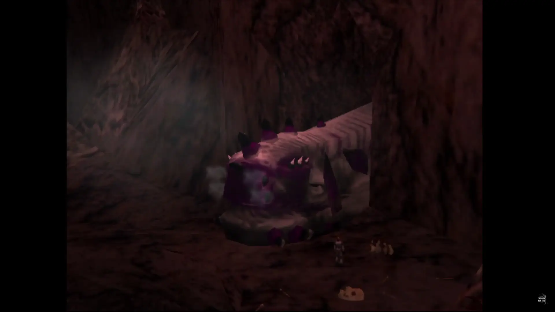 A massive creature laying in a tunnel exhaling mists of vapour.